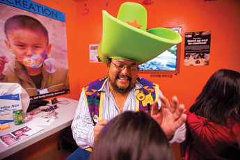 Lions Club volunteer Stanley Van Keuren Jr. paints childrens faces during the Zoo Boo Halloween event at the Navajo Nation Zoo Friday. © 2011 Gallup Independent / Cable Hoover 
